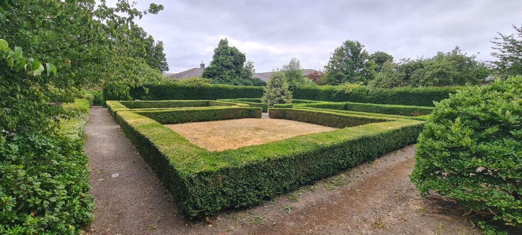 Walking talking therapy in walled garden, Croesnewydd Hall Wrexham - cross garden view